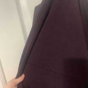 Super comfy plum dress, longer in the back with tie detail at the bottom